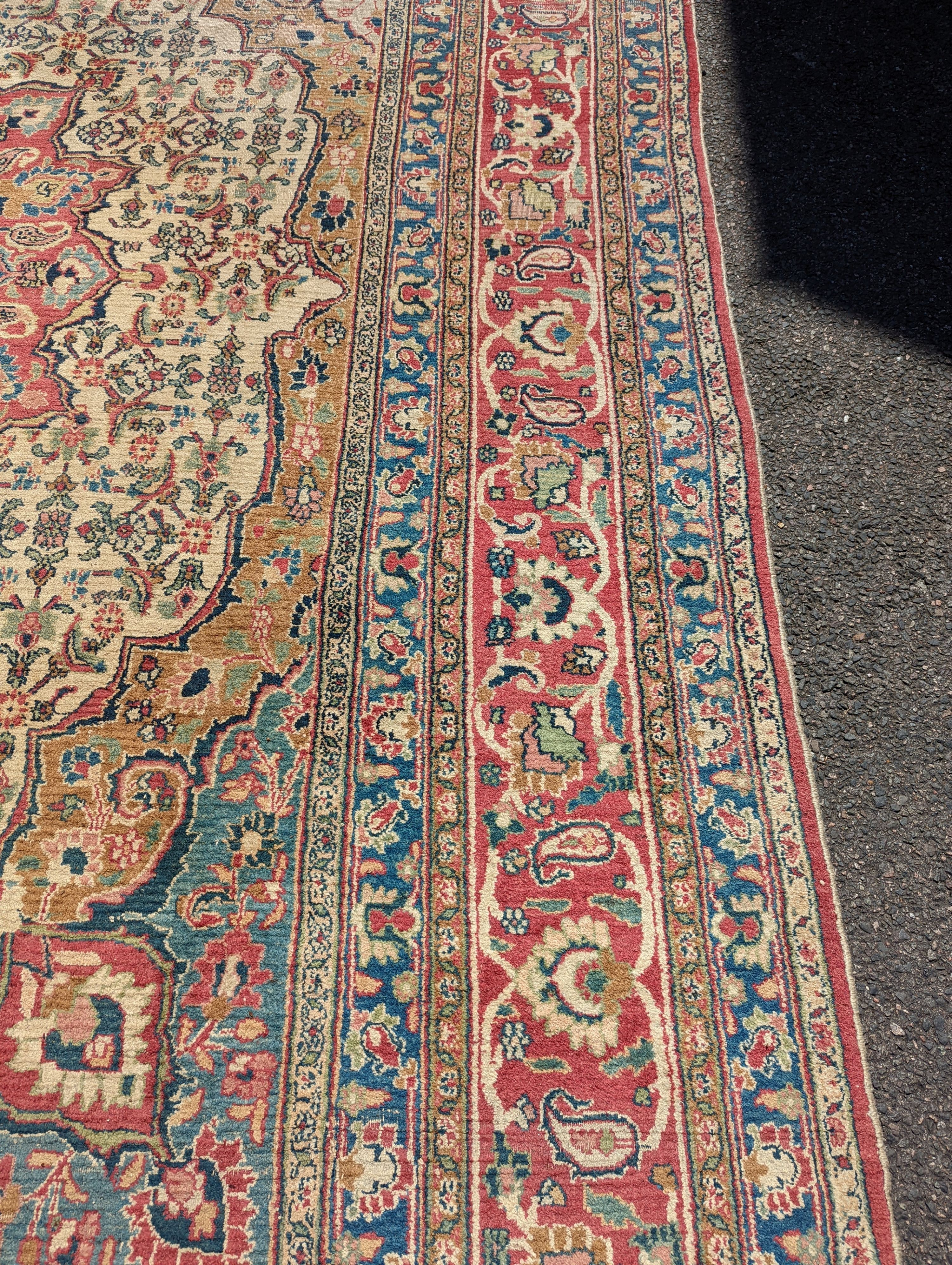 An Isfahan ivory ground carpet, 432 x 330cm